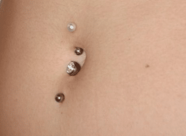 Bottom navel piercing healing stages